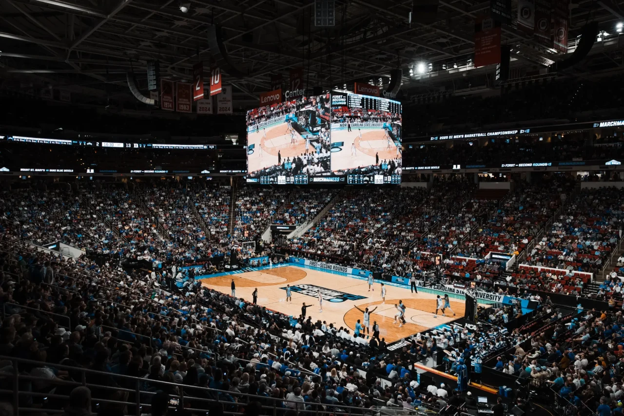 A packed Lenovo Center arena during a 2025 NCAA March Madness tournament game in Raleigh