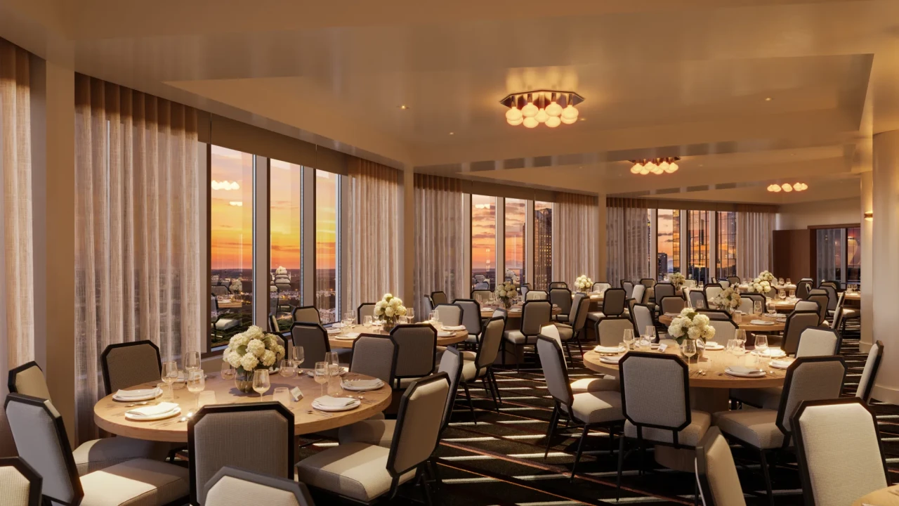 20th-floor ballroom set with round tables for a company celebration dinner