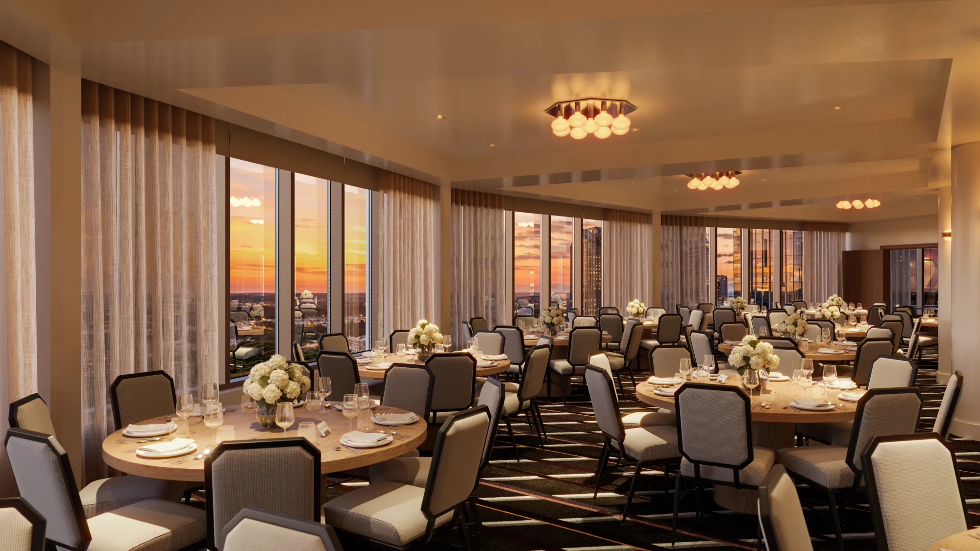 Bright 20th-floor ballroom with tables arranged for a board session